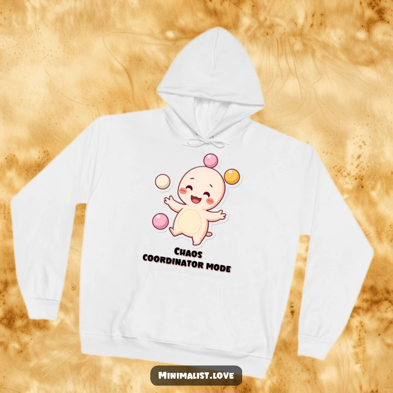 Funny Hoodie showcasing a grinning character with dots for cheeks, skillfully juggling three tiny spheres, a symbol of fun. Excellent funny gift.
